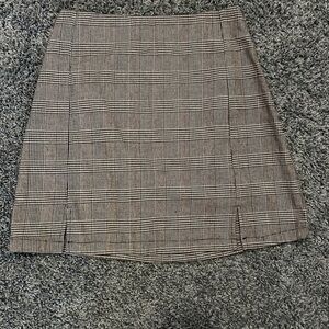 Pacsun black and white plaid skirt. Never worn. One size fits all.